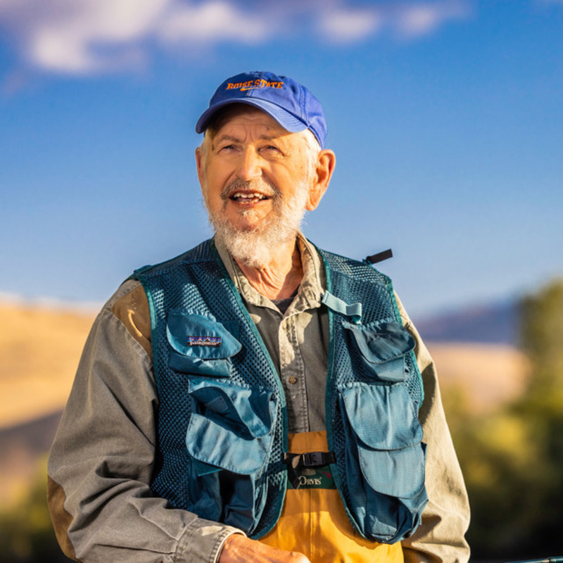 man smiling while fishing